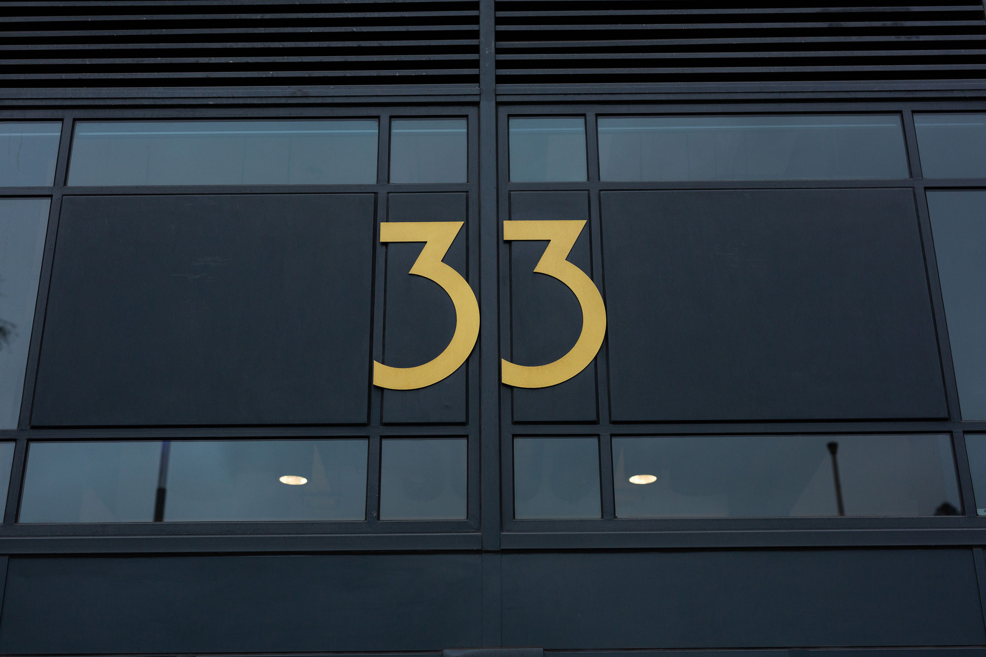 Number 33 sign on the building at 33 Bristol