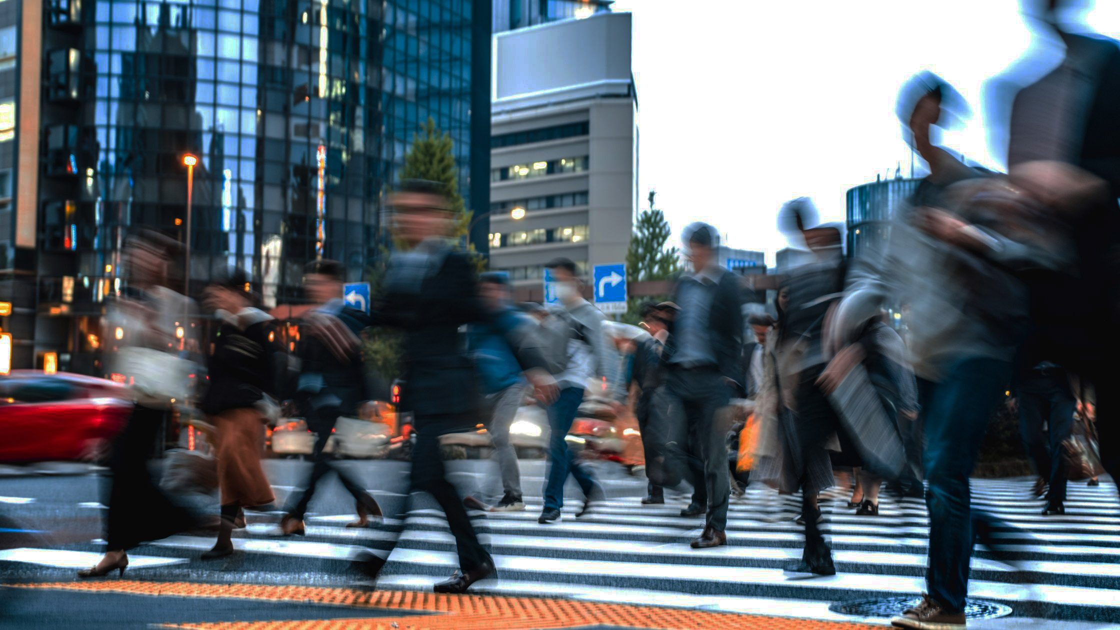 Image of people crossing the road at a zebra crossing